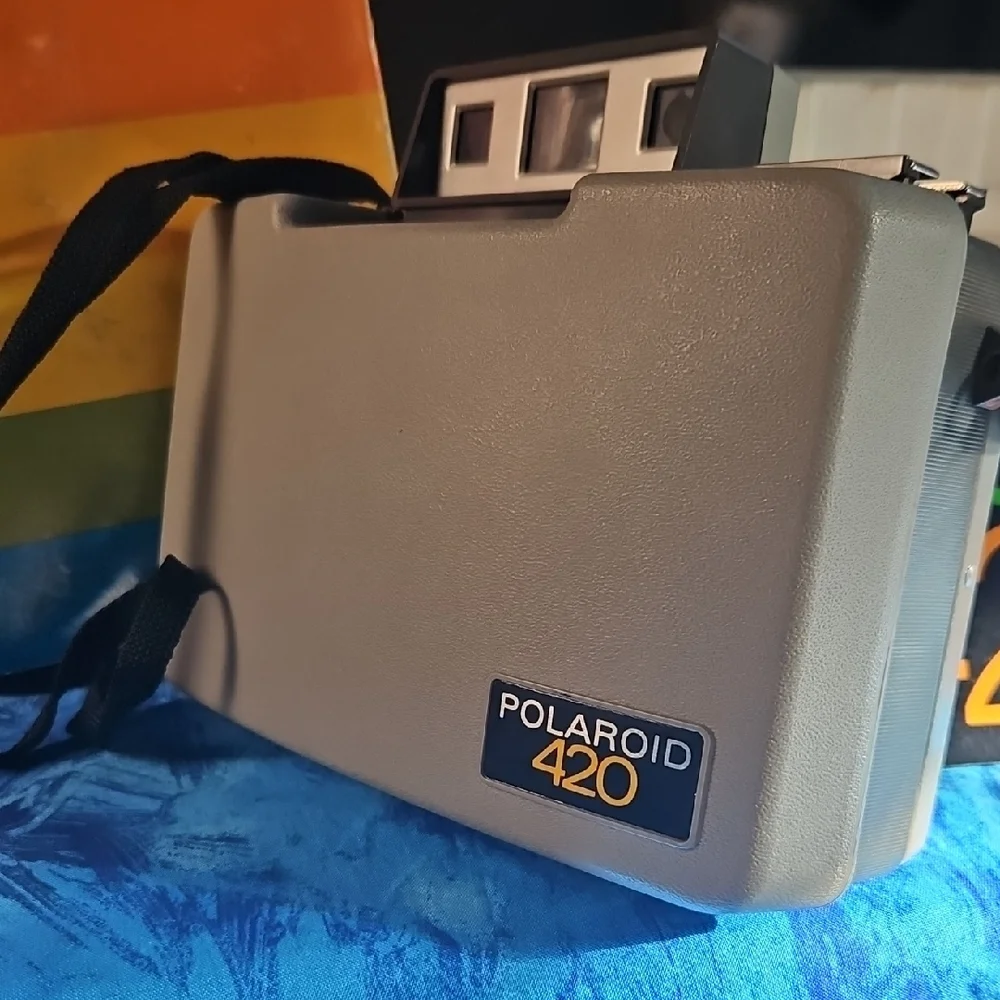 Polaroid Box with Navy Blue and Yellow Lettering